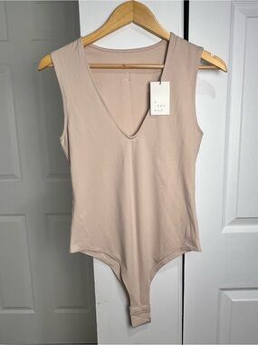 A New Day Womens Beige Sleeveless Bodysuit Deep V Neck Snap Closure Size S NWT